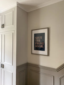 Shut the front door - english phrase in a beautiful print in a stunning hallway